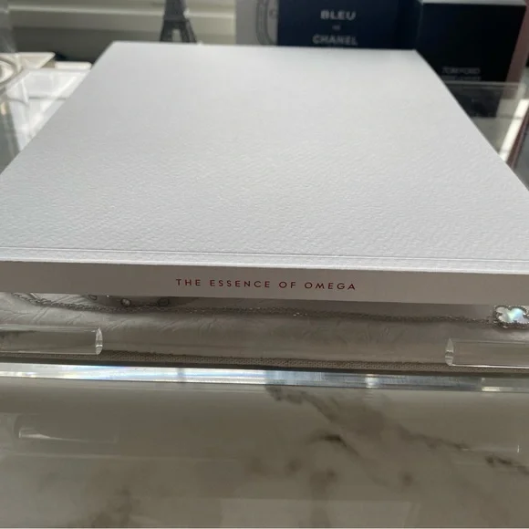 Omega Essence Book with Red Logo